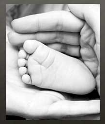 Baby Feet in Mothers Hand